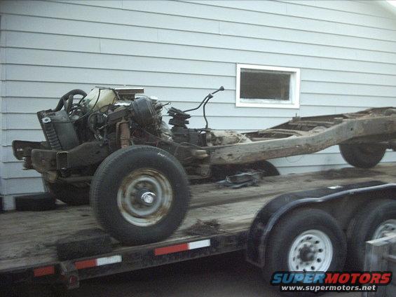 54-build--113009-015.jpg 11-30-09:   Once I got the firewall/cowl area cut down to a manageable size I pulled shifter boots and transmission inspection cover off the floor pan. Then I unbolted 3 of the 4 cab body mount bolts. I couldn't break the 4th body mount bolt loose so I had to cut it. Then it was finally time to lift the floor off the chassis! 

And finally here is the chassis that the 54 body is going on. I'm going to cut out 45" to shorten the wheelbase to the stock 54 F100 wheelbase of 110". 