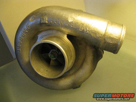 Garrett turbocharger with visible "GARRETT" text and some stamped numbers