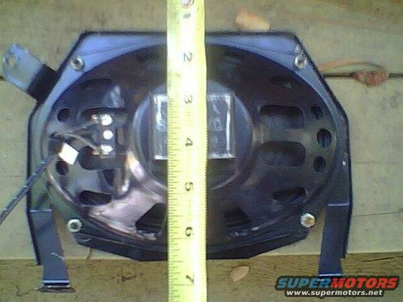 Speaker with a tape measure next to it