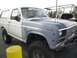 1986 Ford Bronco - This 1986 Ford Bronco features a two-tone paint scheme and BFGoodrich branding on the windshield.