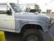 1986 Ford Bronco - 1986 Ford Bronco prerunner with a custom roll cage and primed front fender.