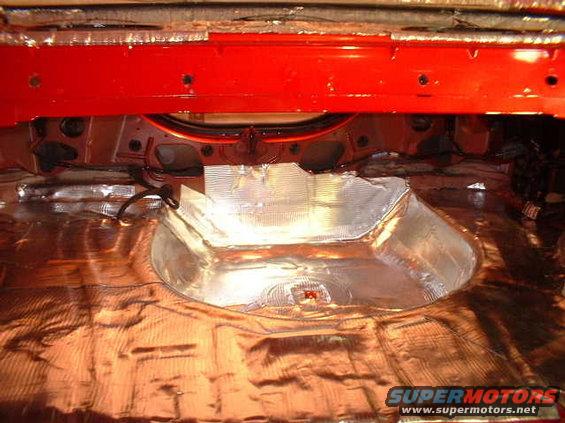 Interior of a 1994 Ford Mustang with soundproofing material applied to the floor and trunk area