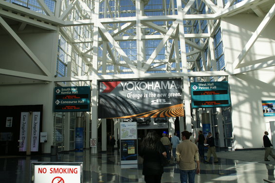 Interior of the LA Convention Center with Yokohama advertisement and directional signs for South Hall, Kentia Hall, Concourse Hall, and West Hall Petree Hall
