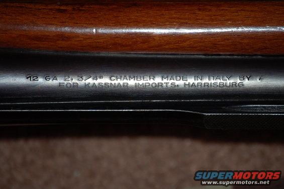 Close-up of shotgun barrel with markings: 12 GA 2 3/4" CHAMBER MADE IN ITALY BY A FOR KASSNAR IMPORTS, HARRISBURG
