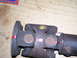 1991 Ford Bronco - A close-up view of a drive shaft, possibly for a 1991 Ford Bronco, shows red paint markings and yellow paint on the yoke.