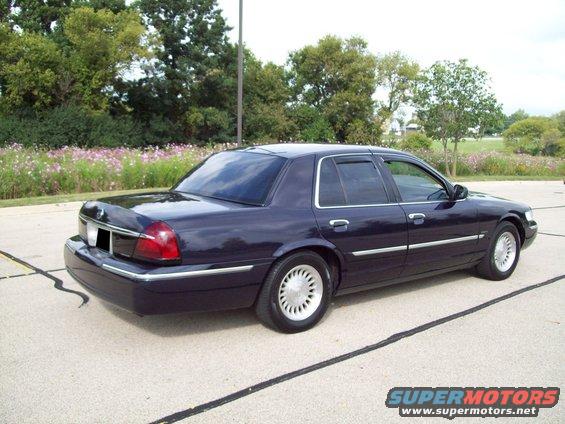 Dark purple 1999 Mercury Grand Marquis sedan, rear 3/4 view