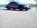 1999 Mercury Grand Marquis - A dark 1999 Mercury Grand Marquis is seen from the front-right, parked near a body of water.