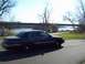 1999 Mercury Grand Marquis - Sedan parked by the water with a bridge overhead.