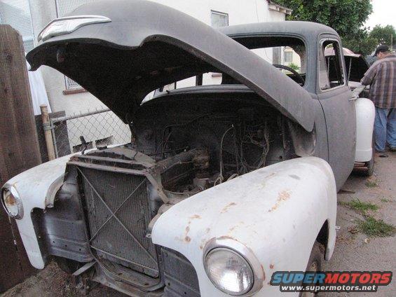 1954 Chevrolet truck front view, hood open, showing engine bay