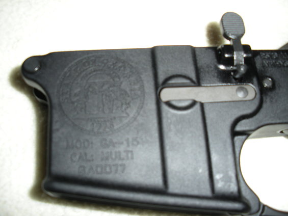 Black firearm receiver with markings 'MOD: GA-15', 'CAL: MULTI', and 'GA0077'