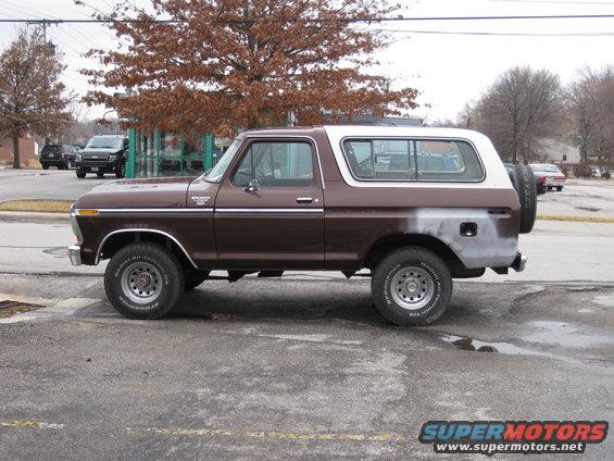 Side view of a brown and white 1978 Ford Bronco parked outside