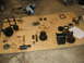 1978 Ford Bronco - Transmission components and tools are laid out on a wooden surface for repair.