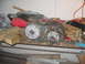 1978 Ford Bronco - Transfer case with JLS marking sits on a workbench next to various tools and wood blocks.
