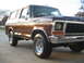 1978 Ford Bronco - This 1978 Ford Bronco is shown from a front three-quarter perspective, highlighting its classic design and brown exterior.