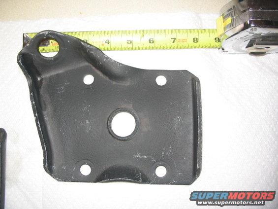 Metal bracket with ruler showing measurements up to 9 inches