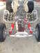 1987 Honda 250 R - The front suspension and engine of an ATV are shown in this close-up view.