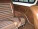 1978 Ford Bronco - Interior view of a 1978 Ford Bronco, highlighting the distinctive striped seat fabric and brown trim.