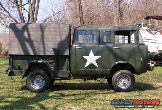 Green military truck with a white star on the side and a canvas bed cover
