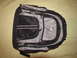 1984 Ford Bronco - A black and gray backpack is shown laid out on a textured surface.