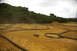 1986 Ford Bronco - A remote control car navigates a custom-built dirt track with various obstacles and turns.