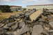1986 Ford Bronco - RC rock crawler navigating a pile of demolition debris.
