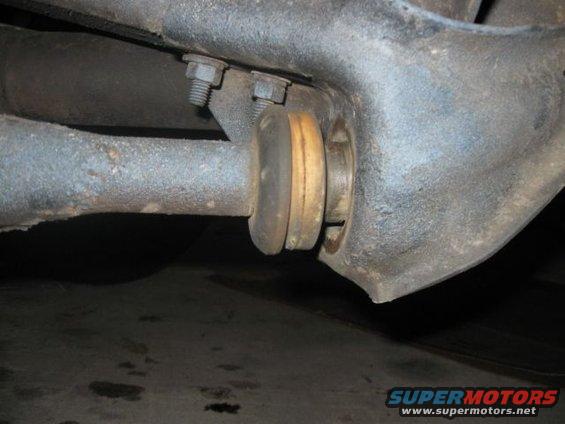 Suspension bushing with metal bracket and bolts