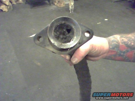 Exhaust pipe flange held in hand