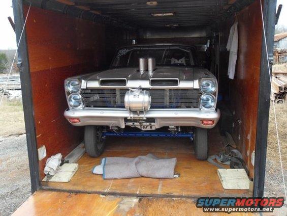 Silver 1963 Ford Fairlane drag car inside a trailer, viewed from the front