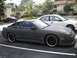 1991 Nissan 240SX - A dark gray 1991 Nissan 240SX is parked in a lot with other vehicles.