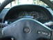 1991 Nissan 240SX - Interior view of a 1991 Nissan 240SX dashboard, showing the speedometer, tachometer, and a blue digital display unit.