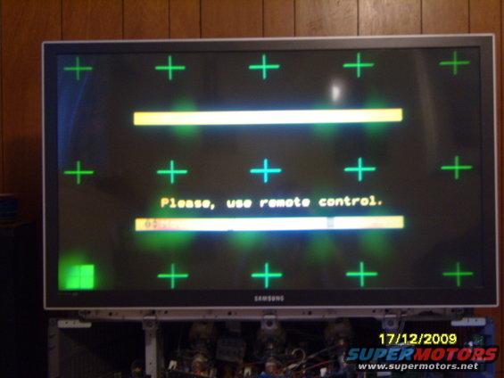 Samsung TV screen with crosshairs and 'Please, use remote control.' message