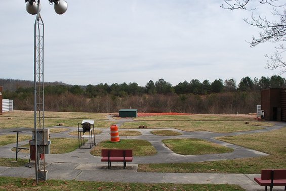 Outdoor shooting range with multiple lanes and benches