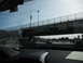 1991 Ford Bronco - Vehicles drive on a highway under an overpass with an "International Border 500 FEET" sign.