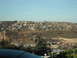 1991 Ford Bronco - View of a densely populated hillside town with industrial areas in the foreground.