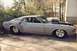 1969 Ford Mustang - This 1969 Ford Mustang is set up for drag racing with a prominent hood scoop and wide rear tires.