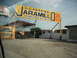 1991 Ford Bronco - A large yellow sign advertises Llanta Jaramillo, offering 24-hour tire services and alignment.