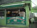 1991 Ford Bronco - A food stand with a green awning and a banner advertising 'Tortilleria Libertad 4' is visible.