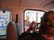 1991 Ford Bronco - A person inside a vehicle photographs a smiling employee through a drive-thru window.