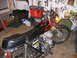 2002 Buell Lightning w/Fairing - A motorcycle with flame decals sits in a garage with tools on the wall.