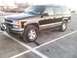 1998 Chevrolet Tahoe - This 1998 Chevrolet Tahoe SUV is seen from a three-quarter front angle, equipped with a bull bar and auxiliary lights.