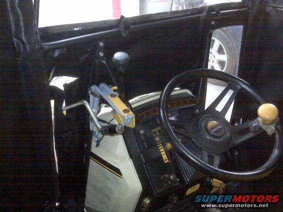 Interior view of a vehicle's dashboard and steering wheel