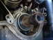 1992 Ford Taurus - Close-up view of an engine's crankshaft seal and surrounding components.