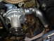 1992 Ford Taurus - This is a close-up view of a vehicle's engine water pump, a critical component for cooling.