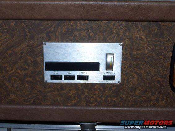 RV control panel with switches for water level, holding tank, and battery condition