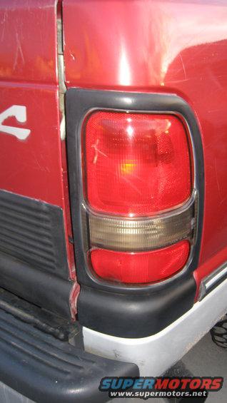 Red 1997 Dodge 2500's rear taillight and quarter panel