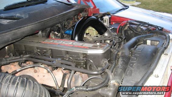 1997 Dodge 2500 engine bay with red Dodge lettering on valve cover