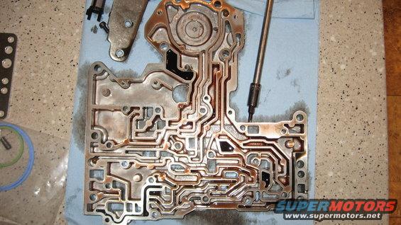 Transmission valve body with intricate fluid channels, some parts removed
