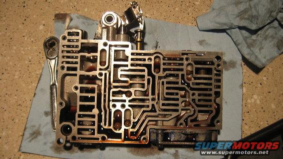 Transmission valve body with a ratchet on a blue shop towel