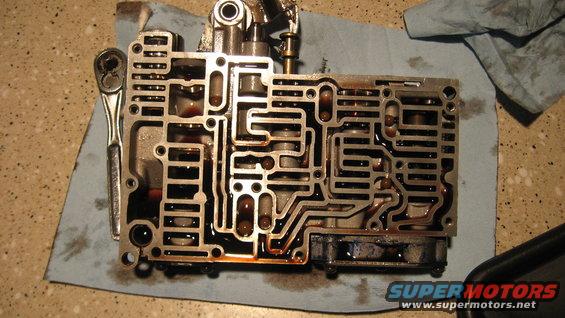Automatic transmission valve body with a ratchet on a blue shop towel