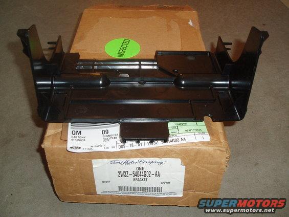 this is the bracket that will mount both the marauder gauge pod or sport receptacle.

mounts under the dash, in the same place as the ashtray bracket.

part number: 2W3Z-54044G02-AA

you will also need a LX sport or marauder metal mount bracket, the p71 bracket that came off with your ashtray/cup holders will not work! this plastic insert slides into the metal dash mount bracket and locks in place, then allowing you to clip in the gauge pod or sport receptacle.

** the metal bracket on non-floor shift models is different from the ashtray/cup holders bracket in p71's. i will try to find a part number for that part, otherwise you can break off the metal taps on the p71 bracket to install the plastic insert. 

SEE pictures at the end of this guide of an OEM LX sport bracket, with this plastic bracket mounted in it. 